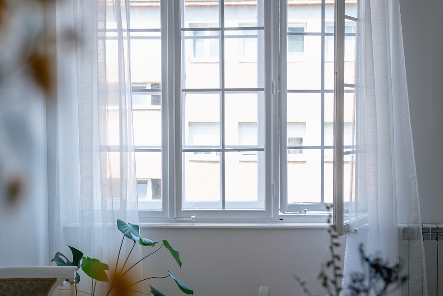Stunning casement windows in a white room.