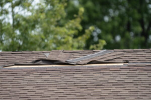 Roof with damaged shingles in need of repair