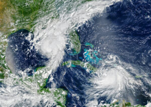 Satellite view of two hurricanes swirling over Florida