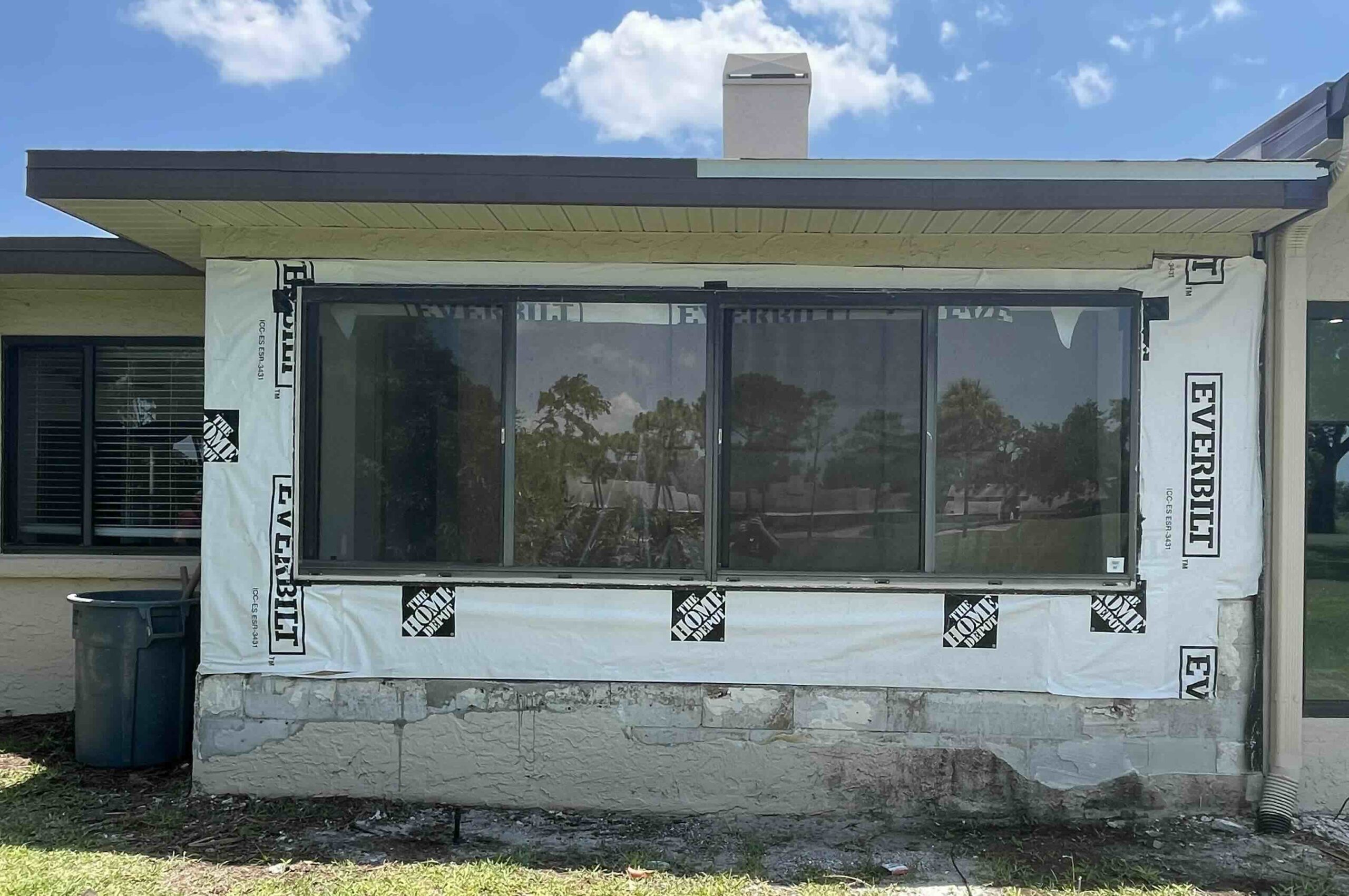 Exterior view of a home being remodeled.