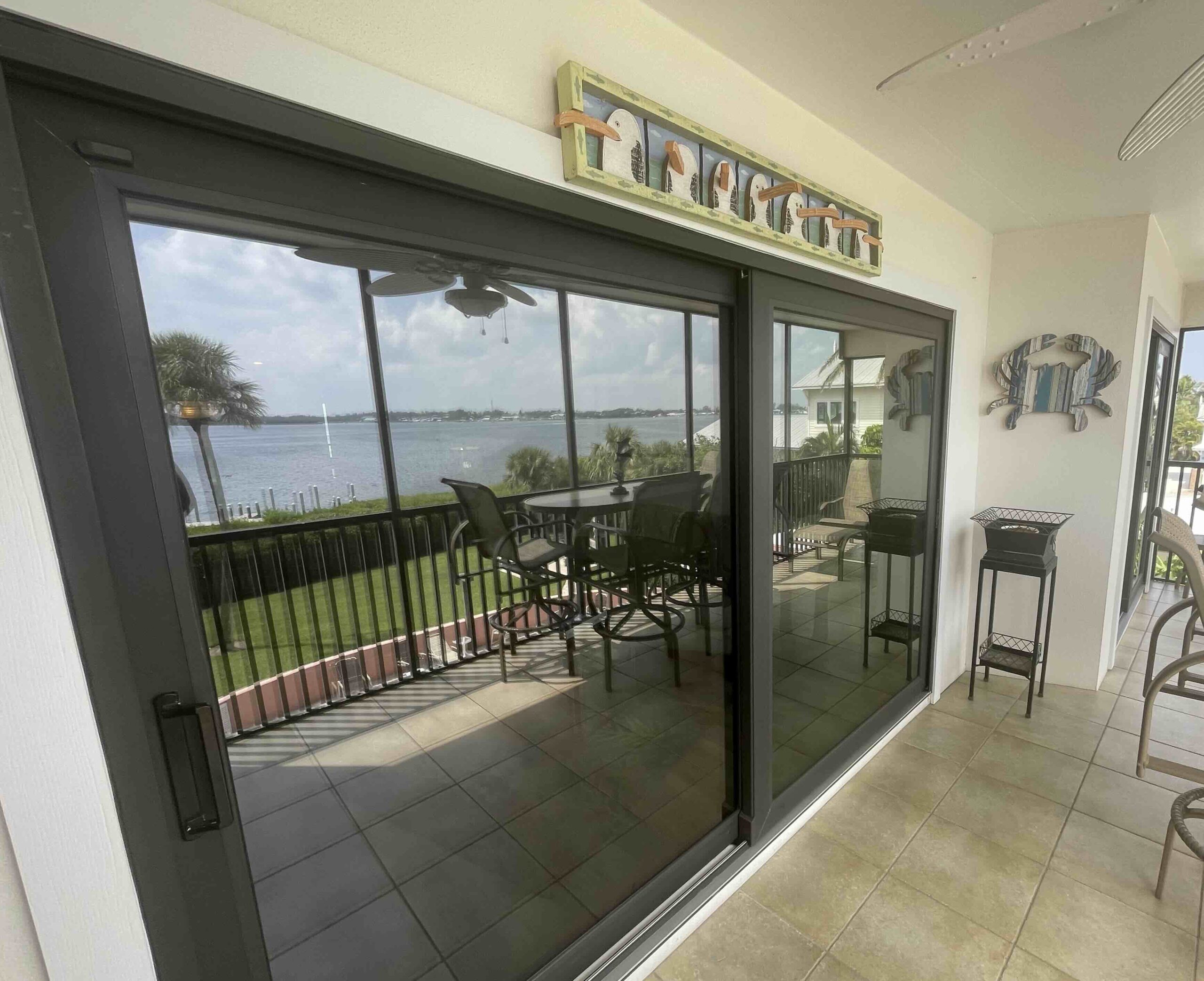 Photo of sliding windows on the porch of a coastside home.